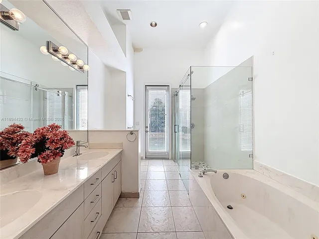 a bathroom with a toilet sink and shower
