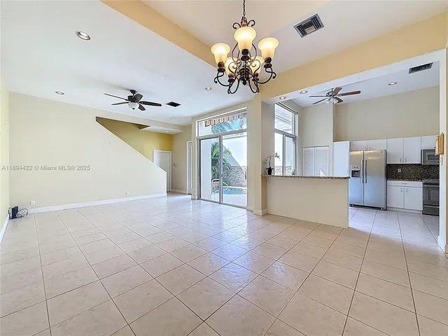 a view of a kitchen with a sink and cabinet area