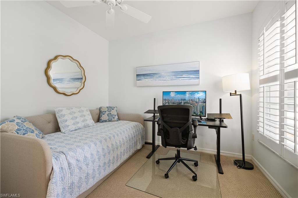 2180 Arielle Drive, Unit 810 Naples, FL 34109 - Photo 14 of 25 a view of a livingroom with furniture and a window
