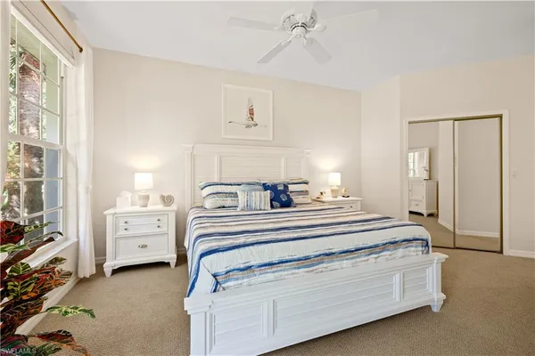 a view of a bedroom with furniture