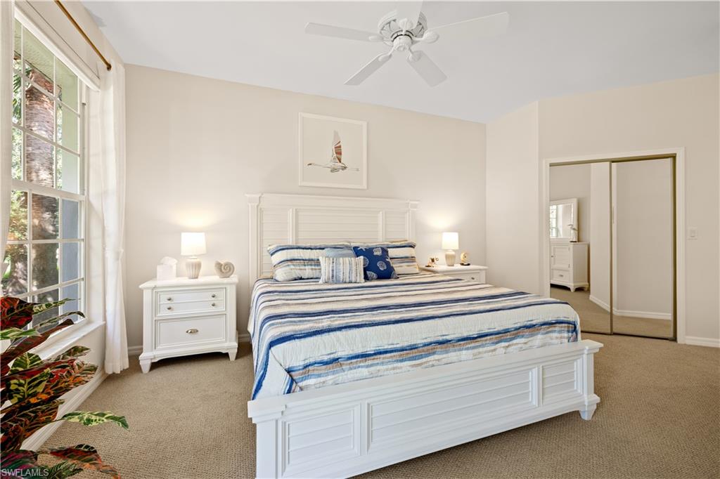 2180 Arielle Drive, Unit 810 Naples, FL 34109 - Photo 18 of 25 a view of a bedroom with furniture