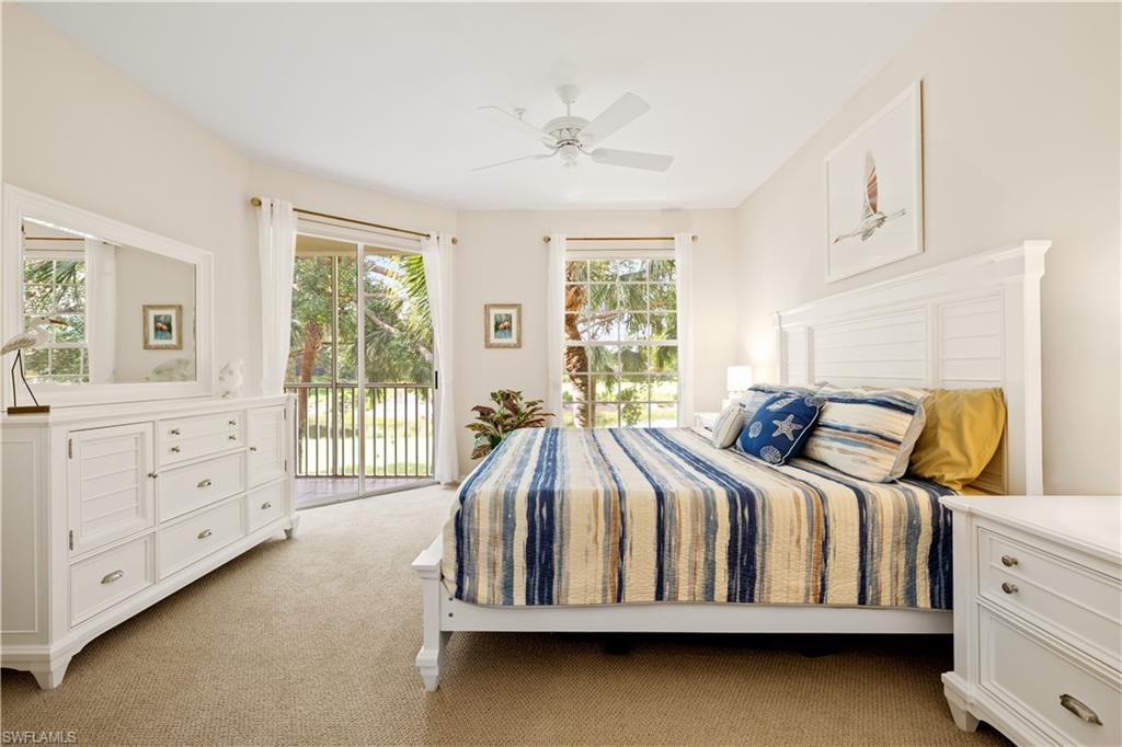 2180 Arielle Drive, Unit 810 Naples, FL 34109 - Photo 19 of 25 a bedroom with a bed and a window