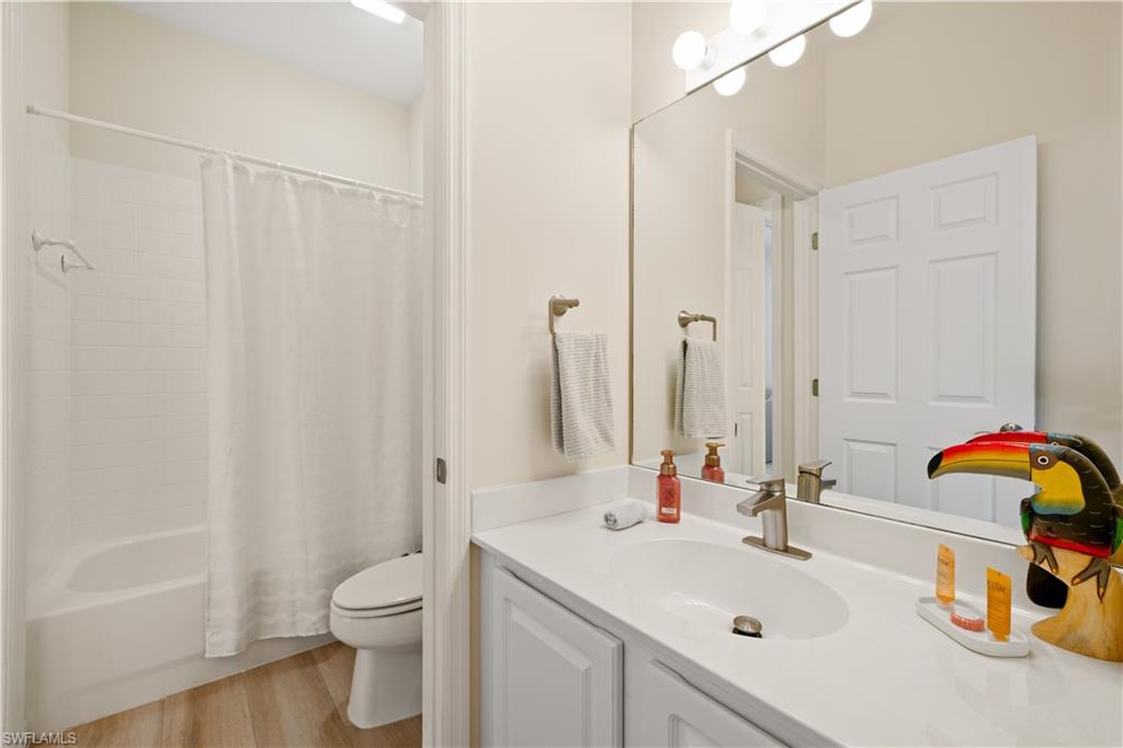 2180 Arielle Drive, Unit 810 Naples, FL 34109 - Photo 20 of 25 a bathroom with a sink toilet and shower