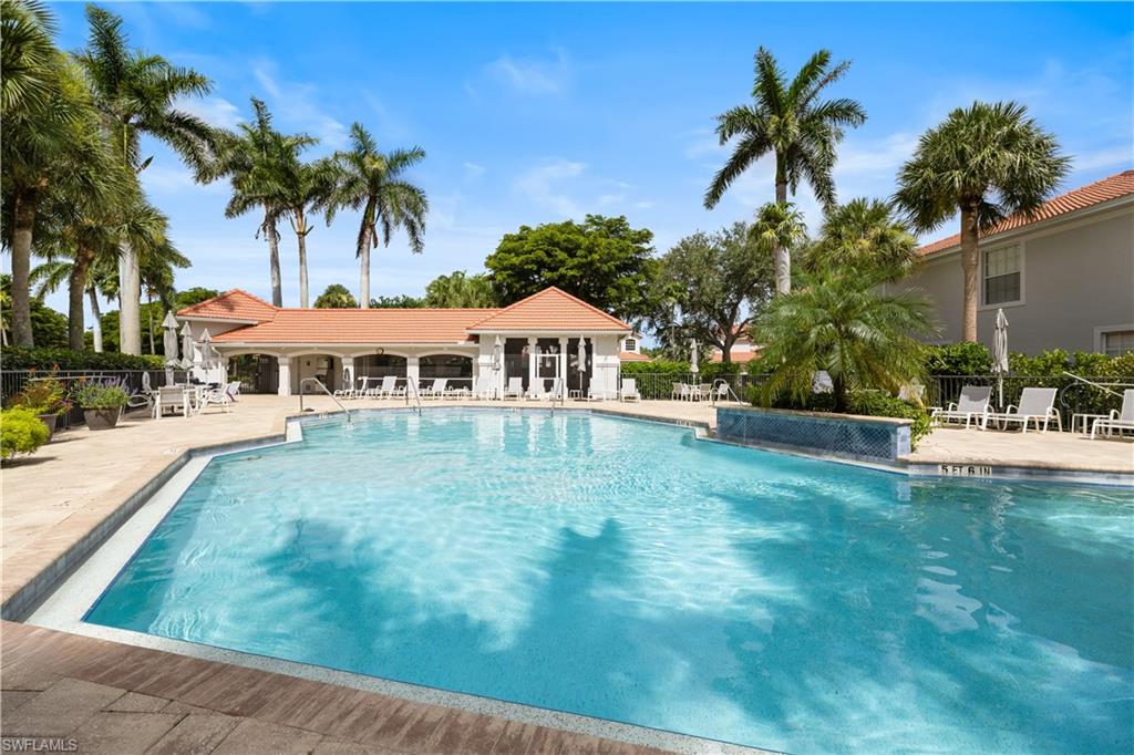 2180 Arielle Drive, Unit 810 Naples, FL 34109 - Photo 24 of 25 a front view of a house with a yard