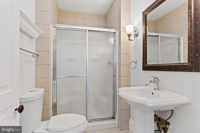 a kitchen with granite countertop white cabinets and a sink