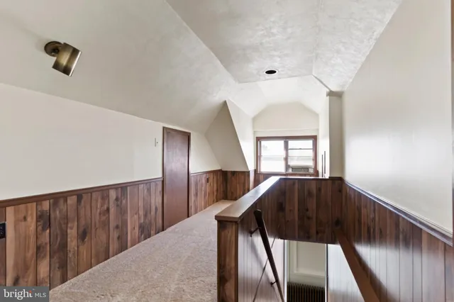 a bathroom with a shower a toilet and sink