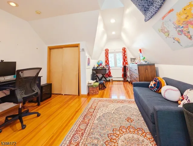 a bed room with a bed and a chair