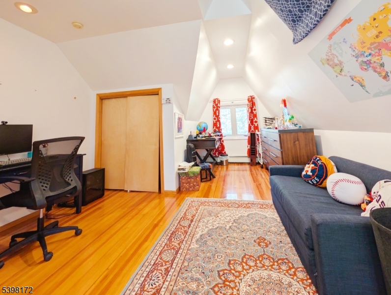 296 Glen Avenue Short Hills, NJ 07078 - Photo 14 of 25 a bed room with a bed and a chair