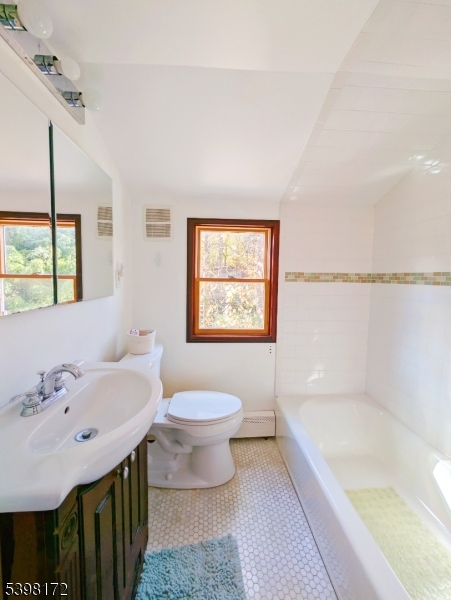 296 Glen Avenue Short Hills, NJ 07078 - Photo 17 of 25 a bathroom with a sink a toilet and bathtub