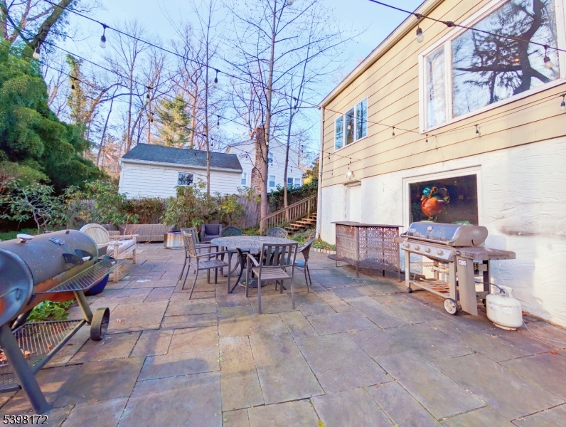 296 Glen Avenue Short Hills, NJ 07078 - Photo 21 of 25 a view of a patio with a table and chairs in patio
