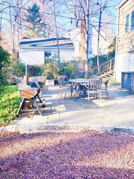 296 Glen Avenue Short Hills, NJ 07078 - Photo 23 of 25 a view of a backyard with sitting area