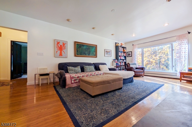 296 Glen Avenue Short Hills, NJ 07078 - Photo 3 of 25 a bedroom with a large bed and a large window
