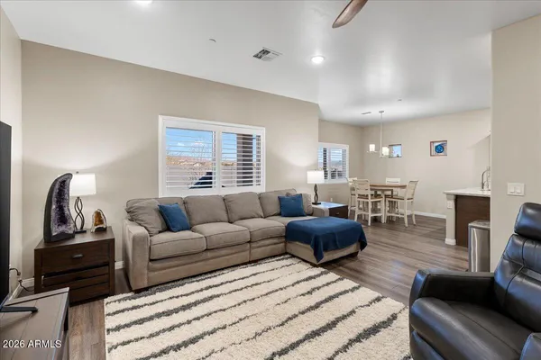 a living room with furniture a rug and a fireplace