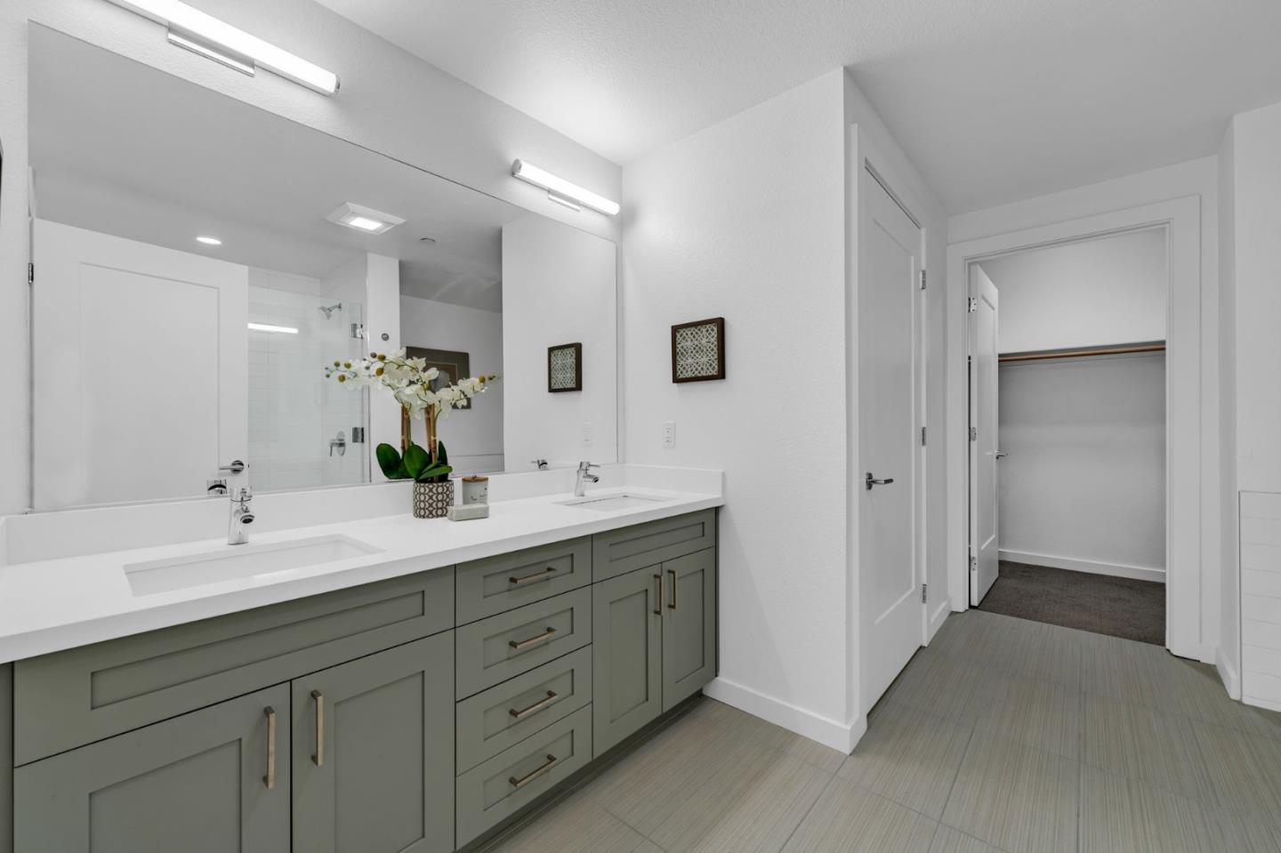 400 El Camino Real, Unit 117 Belmont, CA 94002 - Photo 13 of 54 a spacious bathroom with a double vanity sink mirror and double