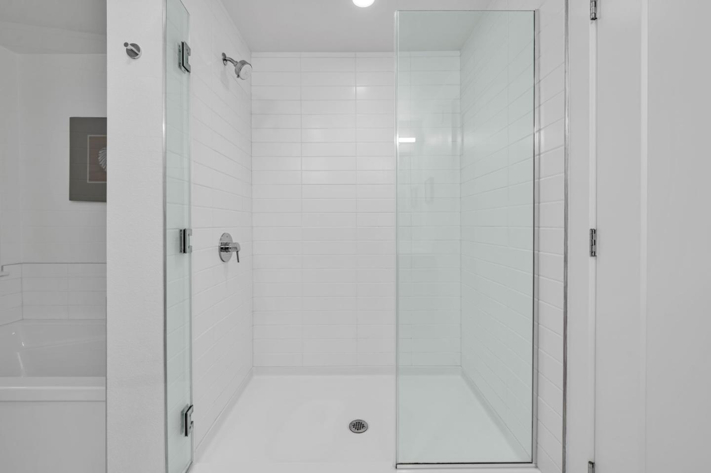 400 El Camino Real, Unit 117 Belmont, CA 94002 - Photo 15 of 54 a bathroom with a glass shower door