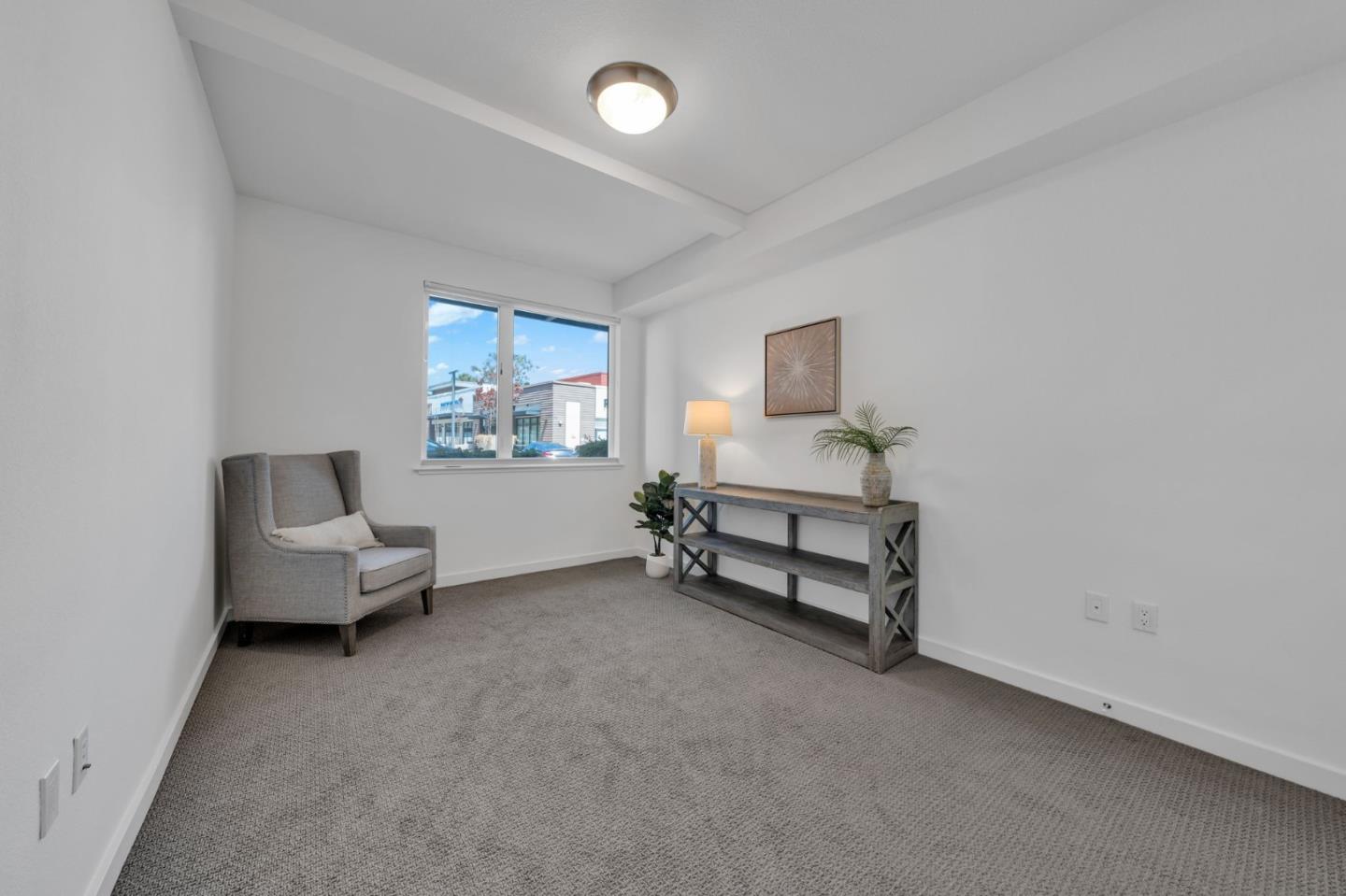400 El Camino Real, Unit 117 Belmont, CA 94002 - Photo 18 of 54 a living room with furniture and a window