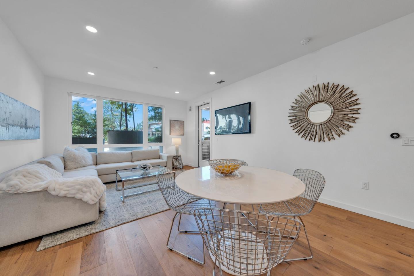 400 El Camino Real, Unit 117 Belmont, CA 94002 - Photo 2 of 54 a living room with furniture and a large window
