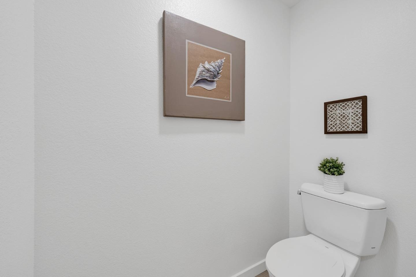 400 El Camino Real, Unit 117 Belmont, CA 94002 - Photo 24 of 54 a white toilet sitting next to a white wall