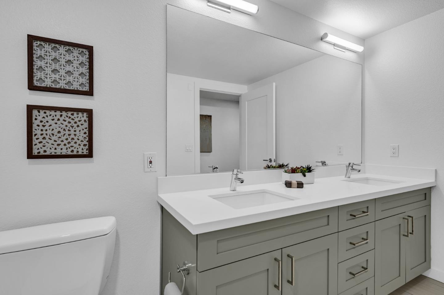 400 El Camino Real, Unit 117 Belmont, CA 94002 - Photo 26 of 54 a bathroom with a sink and a mirror