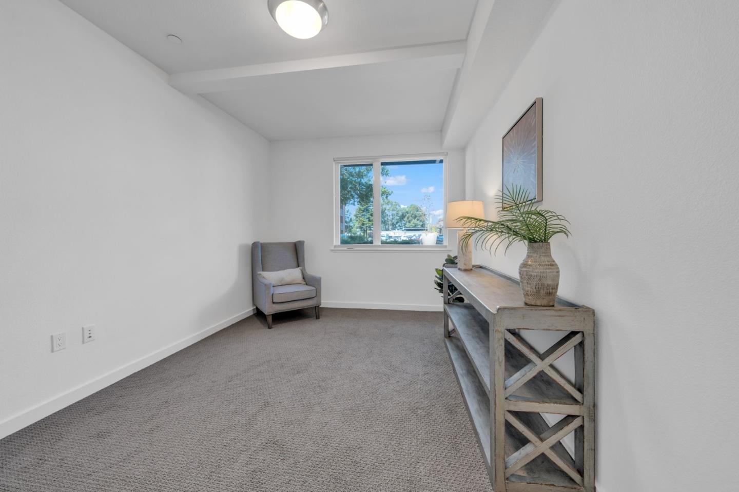 400 El Camino Real, Unit 117 Belmont, CA 94002 - Photo 28 of 54 a living room with furniture and a window