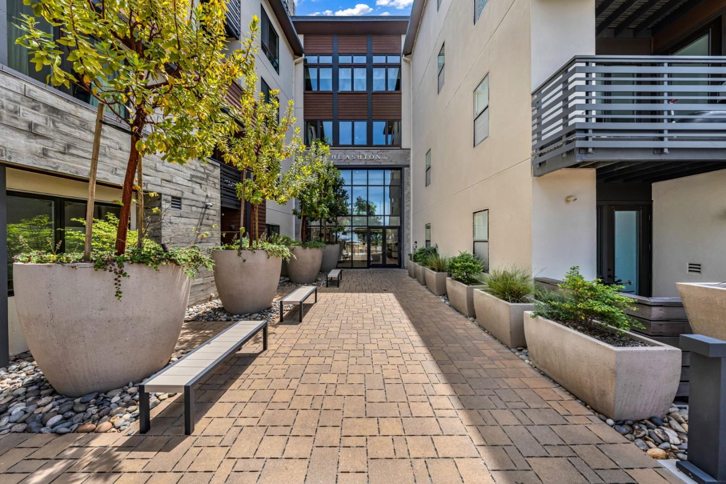 400 El Camino Real, Unit 117 Belmont, CA 94002 - Photo 30 of 54 a view of a building with potted plants