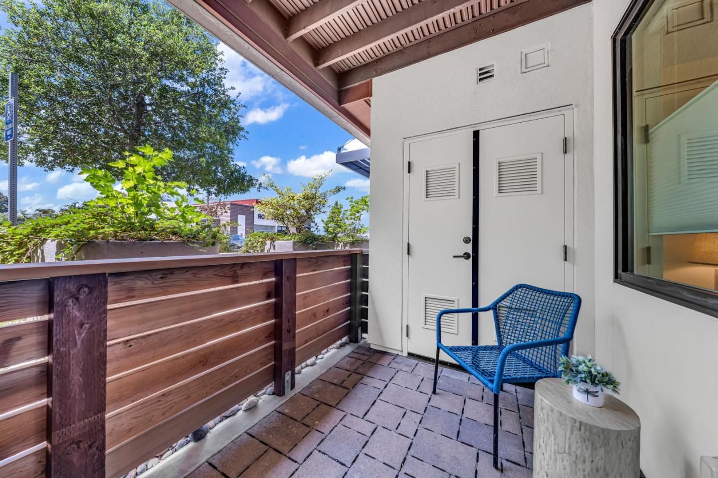 400 El Camino Real, Unit 117 Belmont, CA 94002 - Photo 31 of 54 a balcony with table and chairs