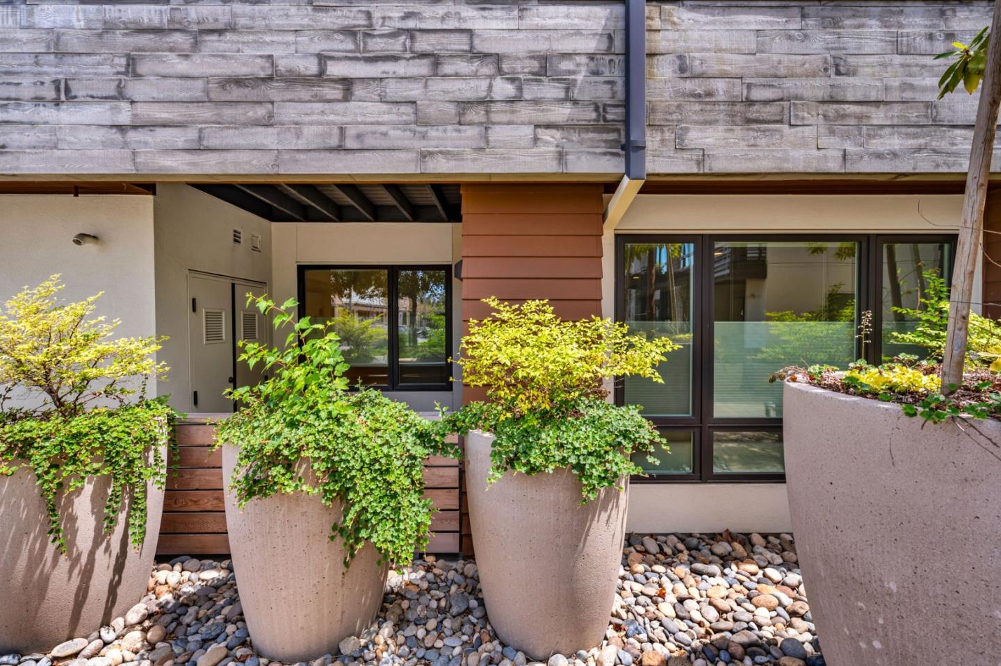 400 El Camino Real, Unit 117 Belmont, CA 94002 - Photo 32 of 54 a view of a house with potted plants