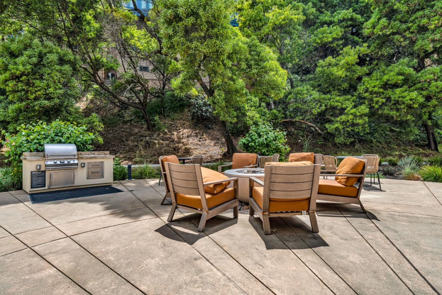 400 El Camino Real, Unit 117 Belmont, CA 94002 - Photo 42 of 54 a backyard of a house with yard and outdoor seating