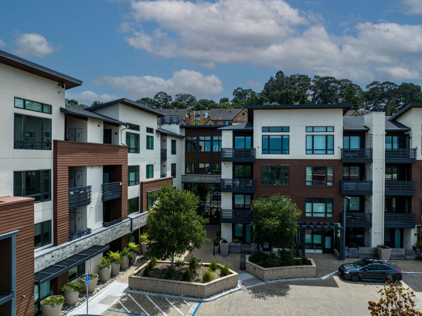 400 El Camino Real, Unit 117 Belmont, CA 94002 - Photo 51 of 54 a front view of residential houses with yard