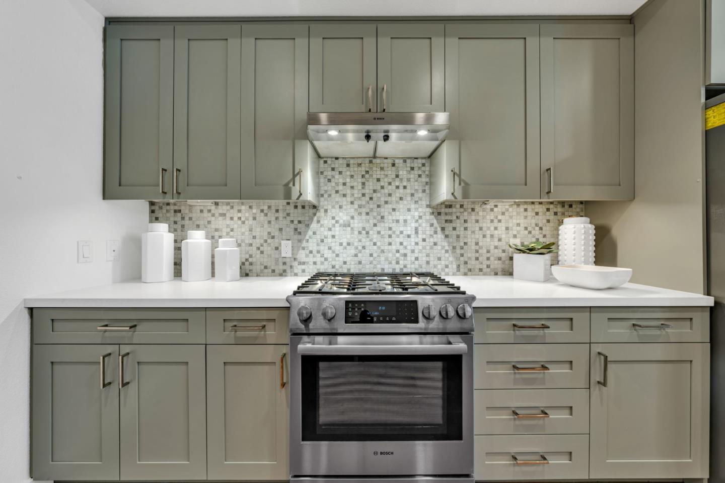 400 El Camino Real, Unit 117 Belmont, CA 94002 - Photo 6 of 54 a kitchen with cabinets appliances and a sink