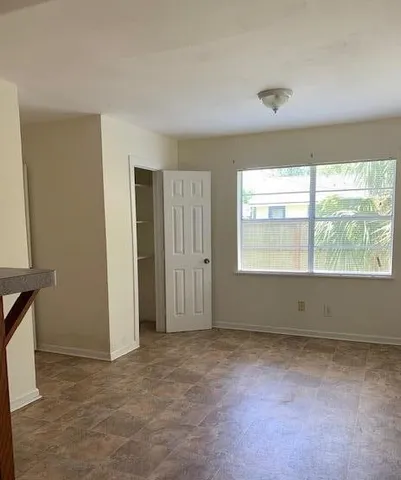 a view of an empty room with a window