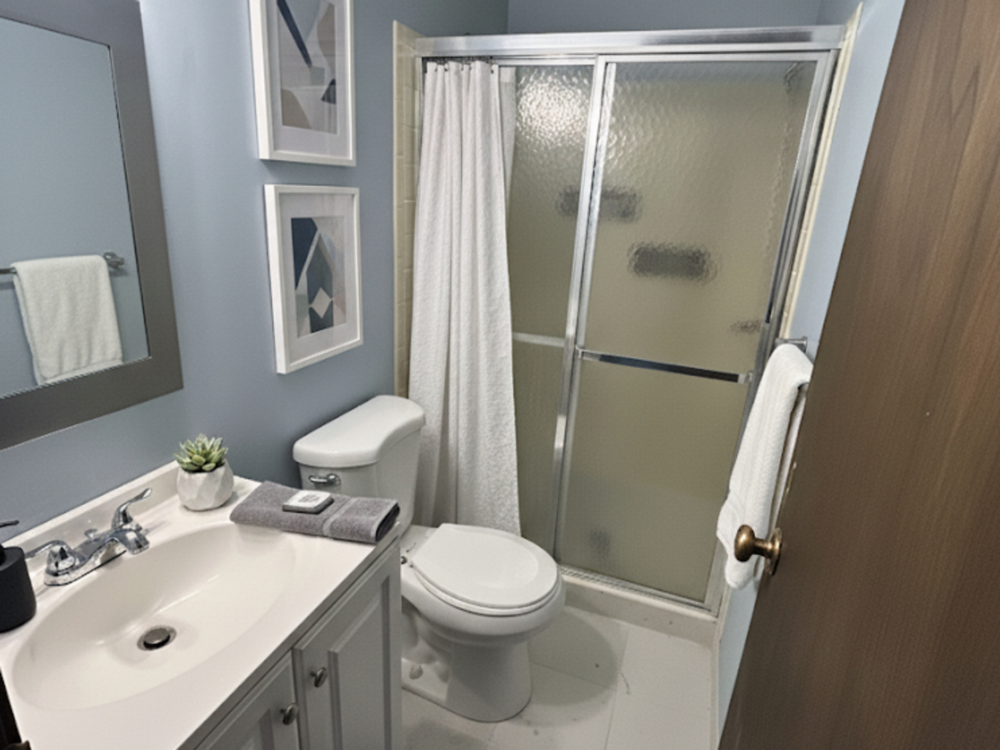 1513 Elder Drive Aurora, IL 60506 - Photo 15 of 26 a bathroom with a sink toilet and shower