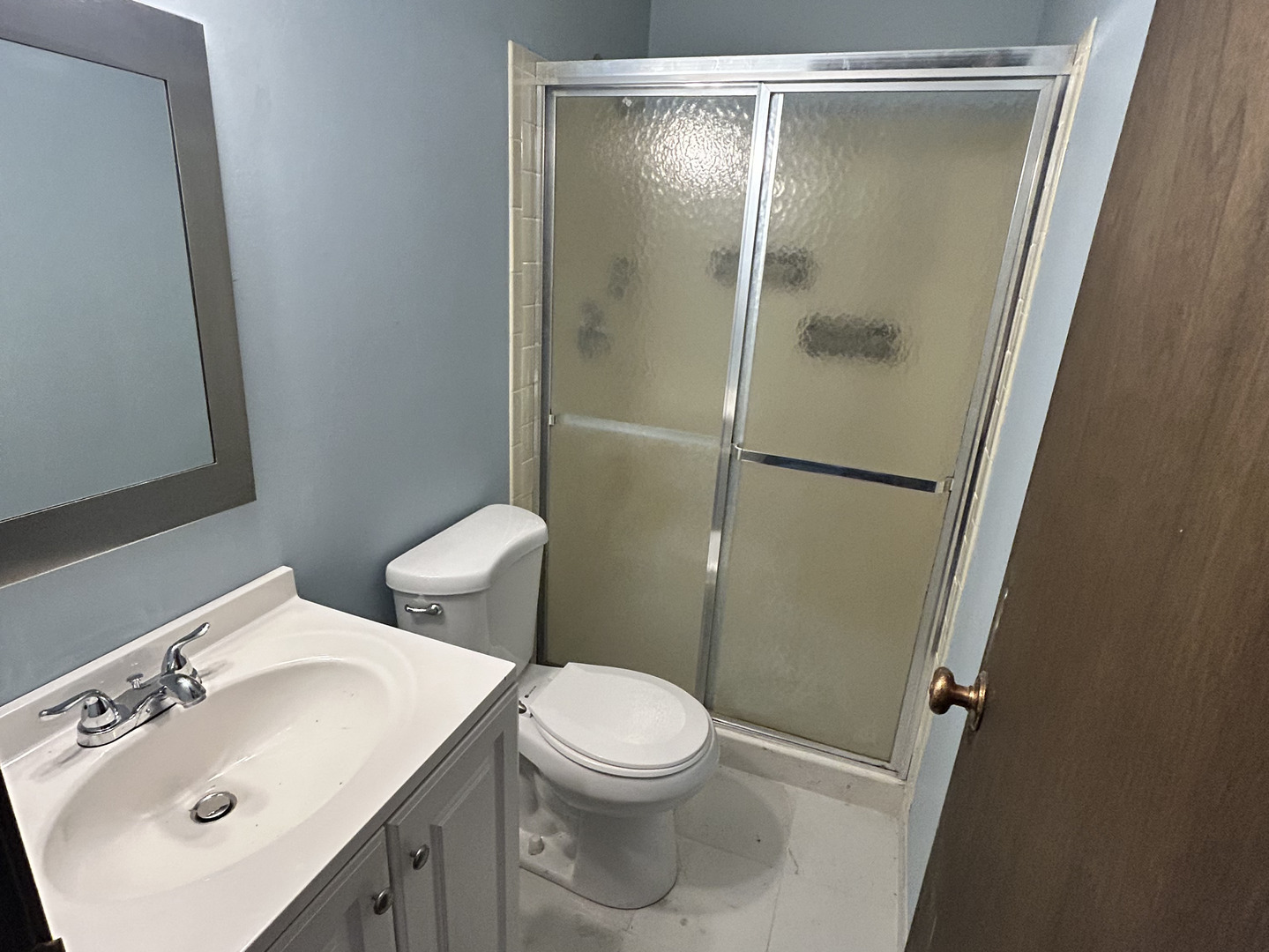 1513 Elder Drive Aurora, IL 60506 - Photo 16 of 26 a bathroom with a sink mirror vanity and toilet