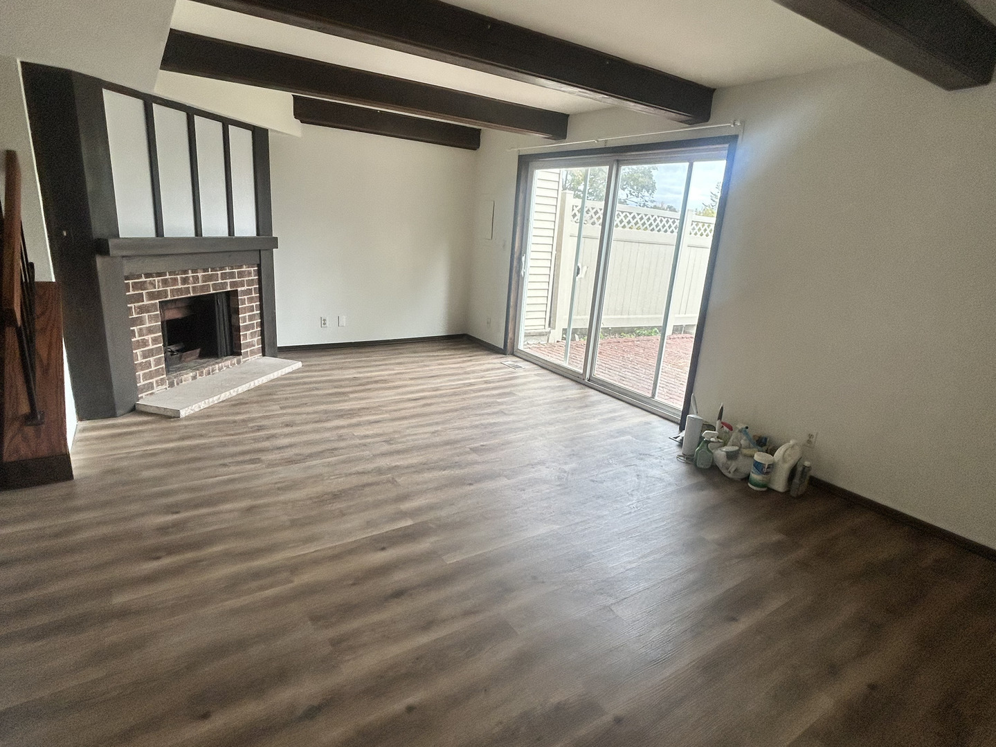 1513 Elder Drive Aurora, IL 60506 - Photo 22 of 26 an empty room with wooden floor and fireplace