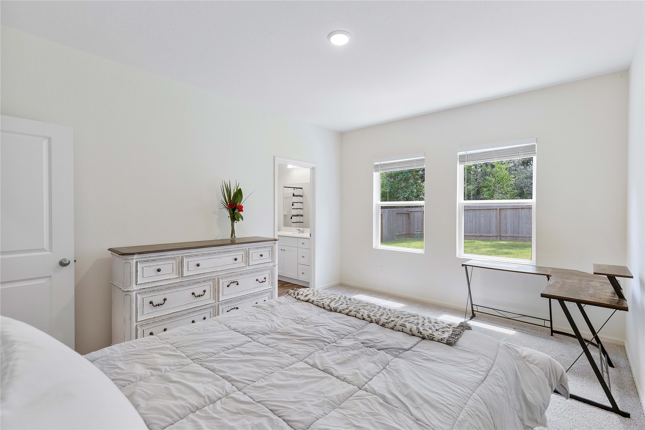 3626 Addington Ct. Huffman, TX 77336 - Photo 14 of 26 a bedroom with a bed and a window with chair