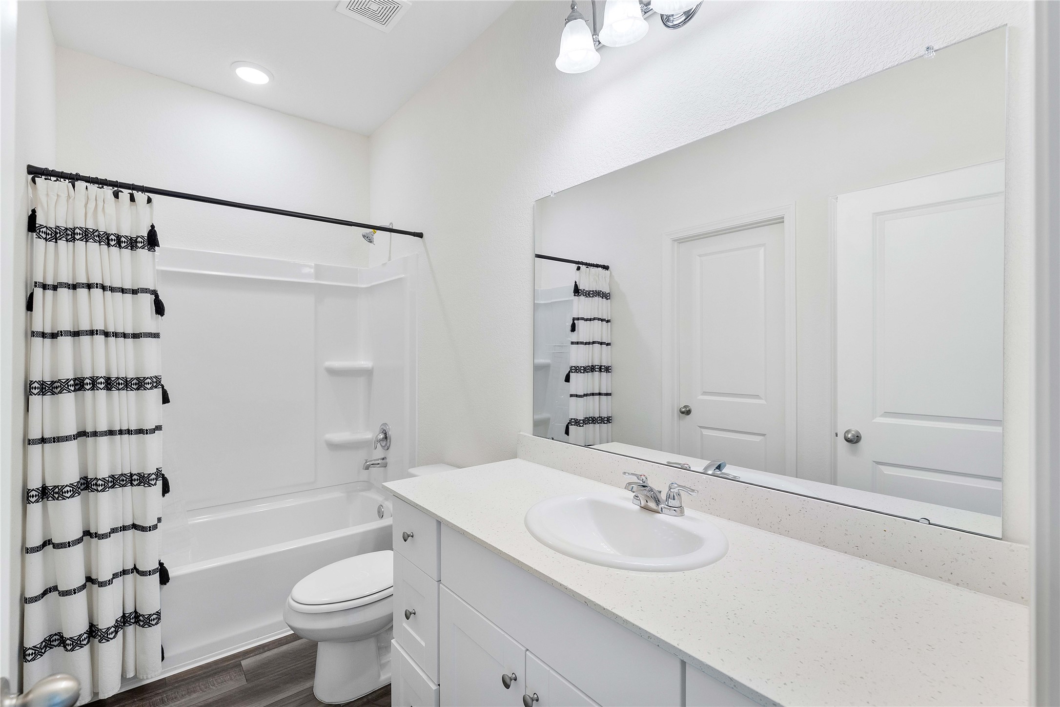 3626 Addington Ct. Huffman, TX 77336 - Photo 16 of 26 a bathroom with a sink a toilet and shower