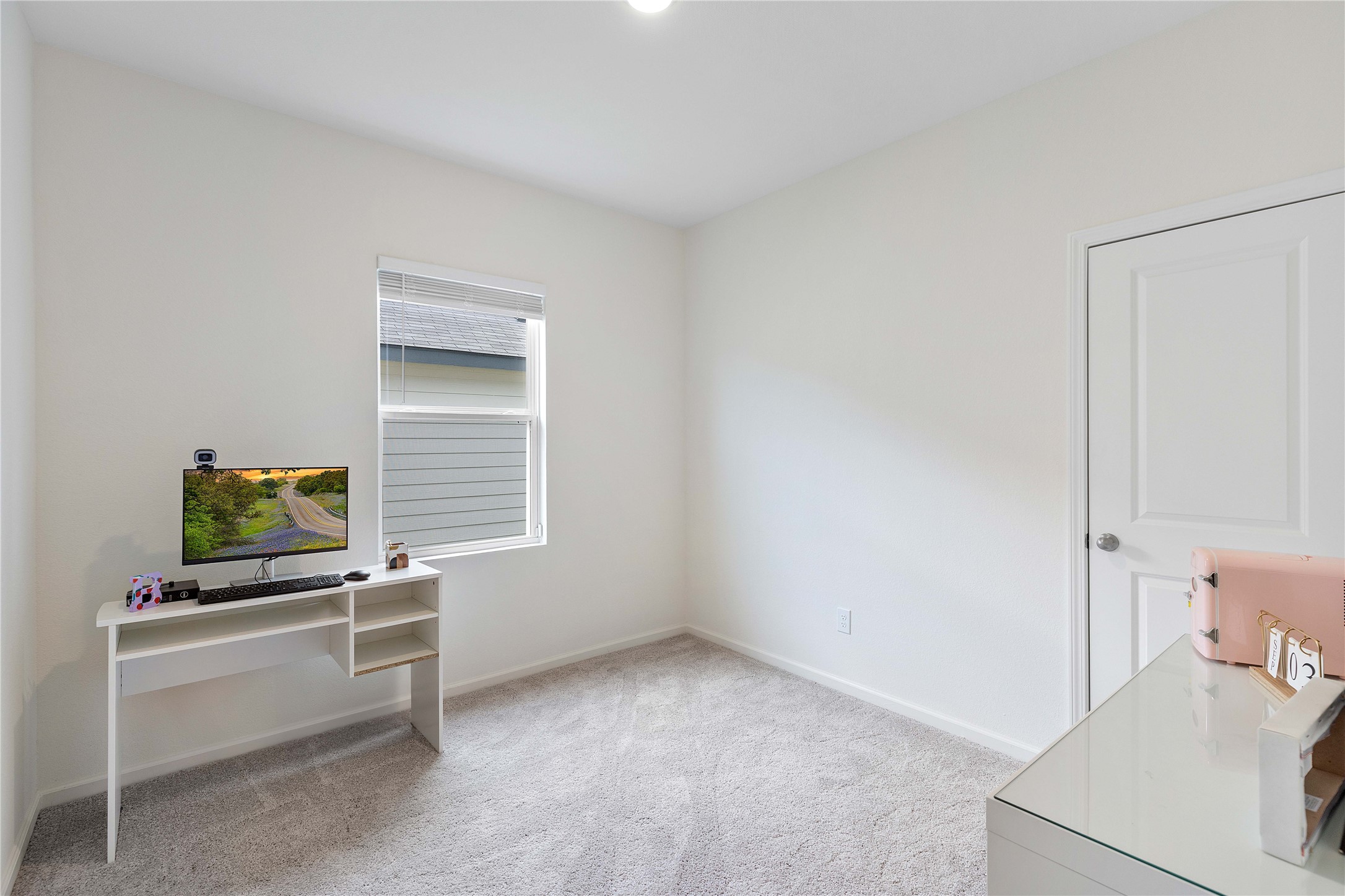 3626 Addington Ct. Huffman, TX 77336 - Photo 17 of 26 a room with a bed and a flat screen tv