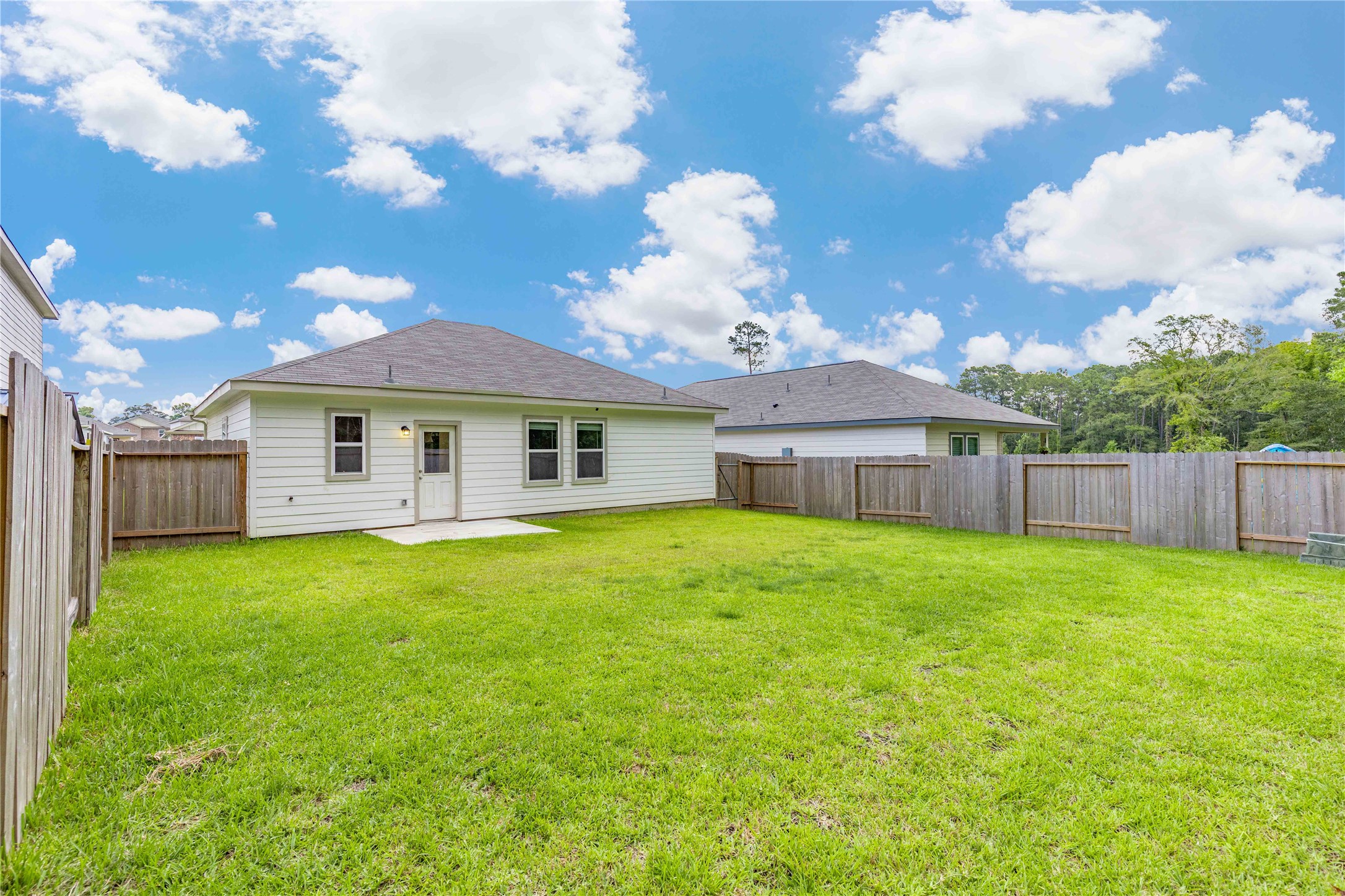 3626 Addington Ct. Huffman, TX 77336 - Photo 23 of 26 a view of a house with backyard and garden