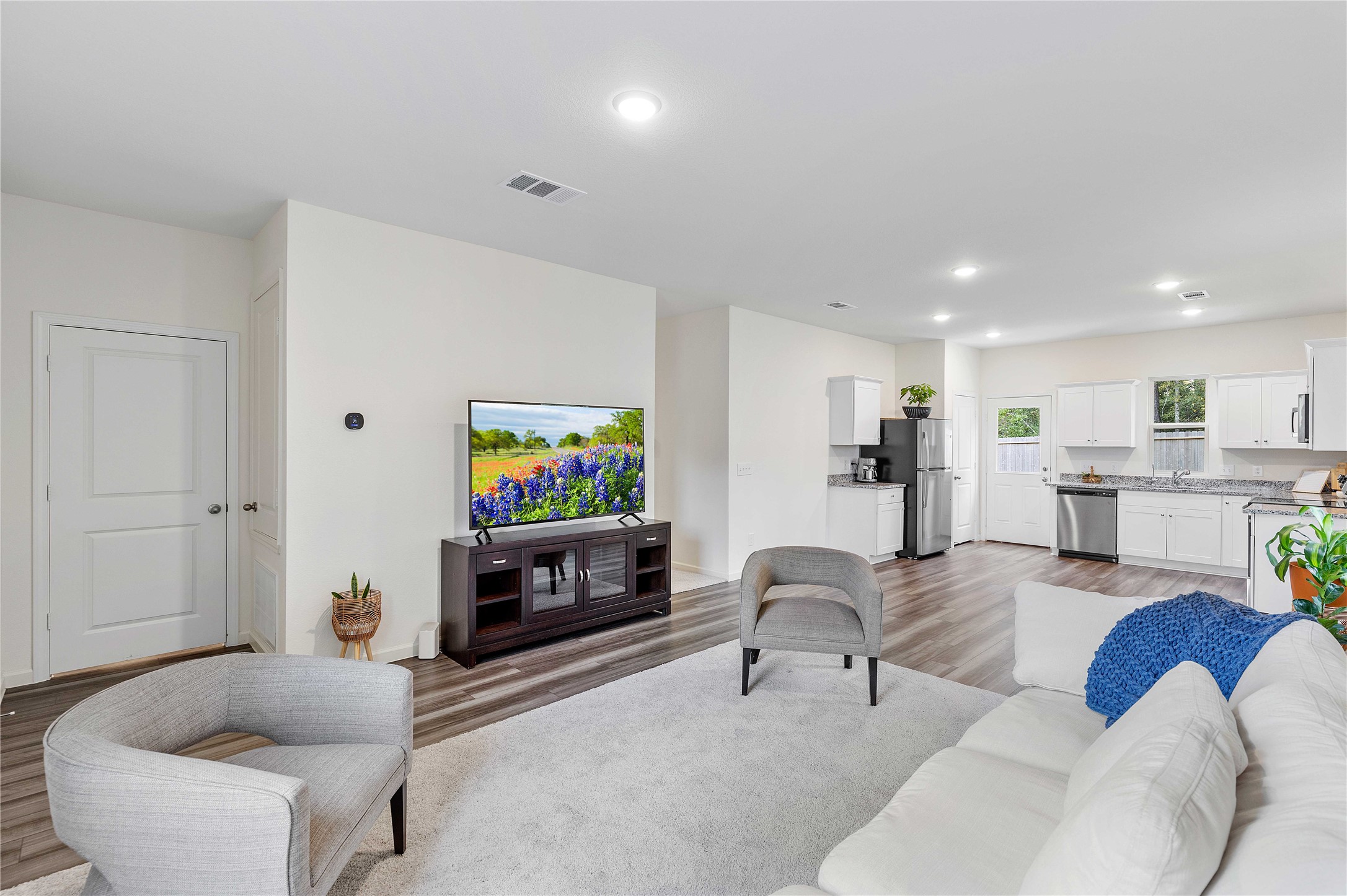 3626 Addington Ct. Huffman, TX 77336 - Photo 5 of 26 a living room with furniture and a flat screen tv