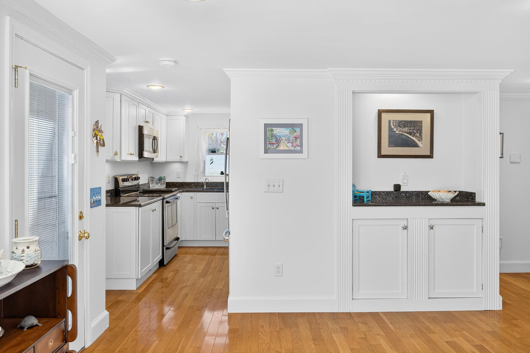 35 Shore Drive Mashpee, MA 02649 - Photo 18 of 36 a kitchen with granite countertop white cabinets and stainless steel appliances