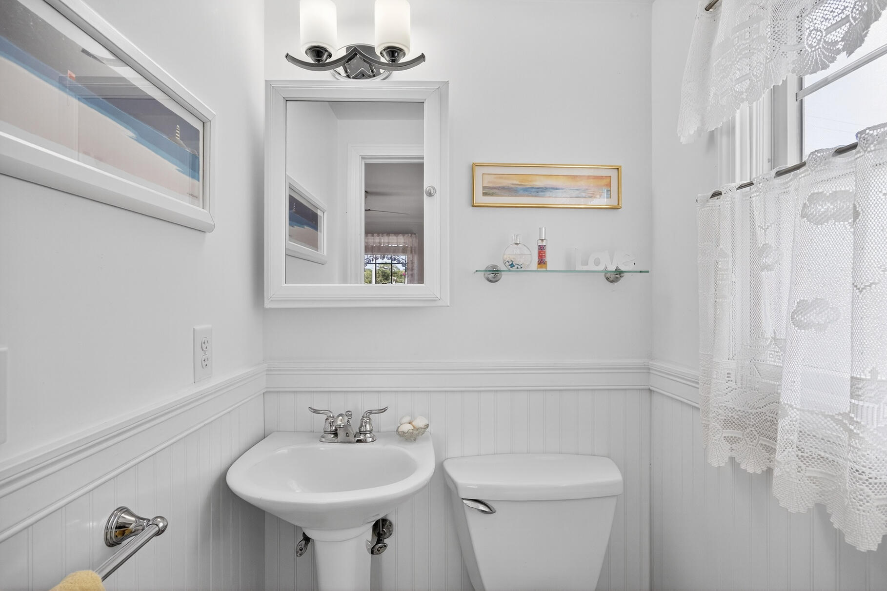 35 Shore Drive Mashpee, MA 02649 - Photo 30 of 36 a bathroom with a sink a mirror and a toilet