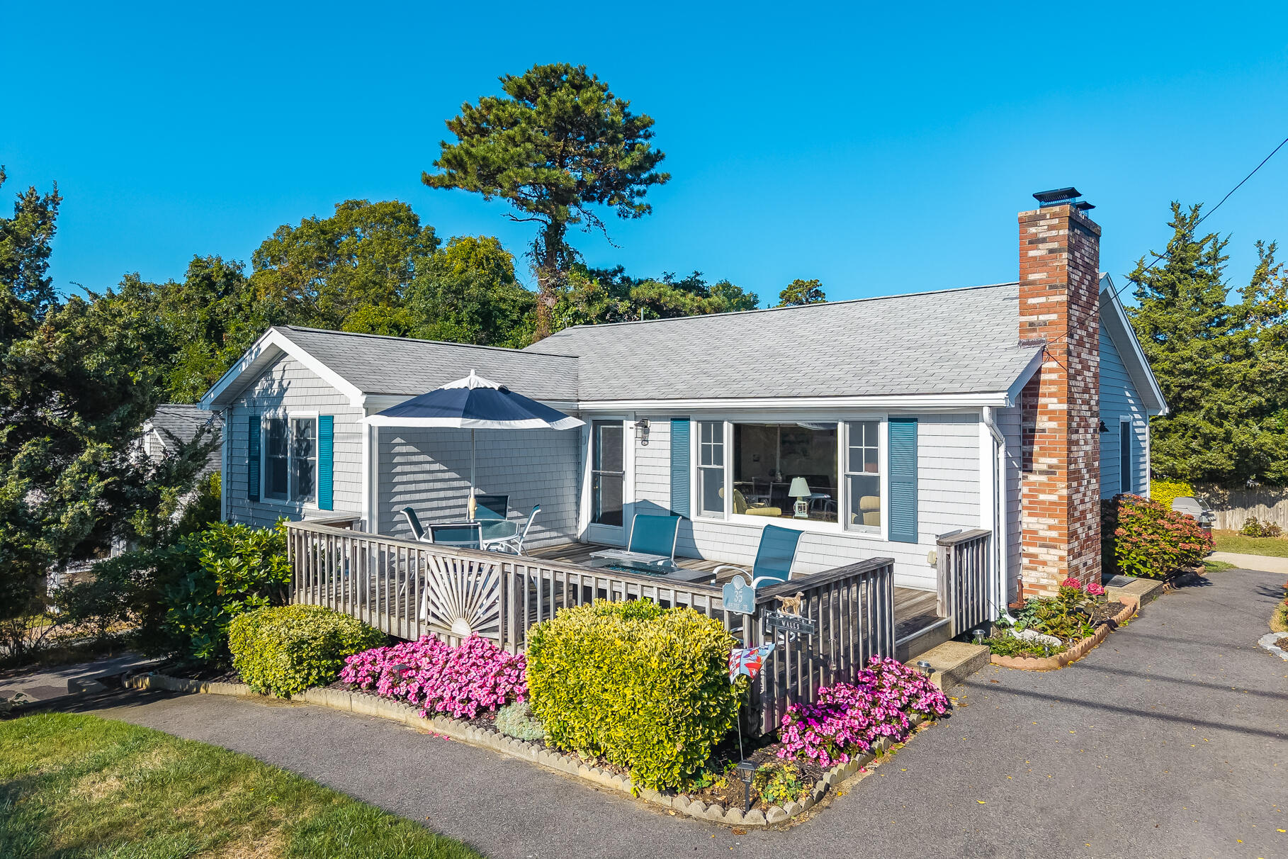 35 Shore Drive Mashpee, MA 02649 - Photo 4 of 36 a front view of house with outdoor seating