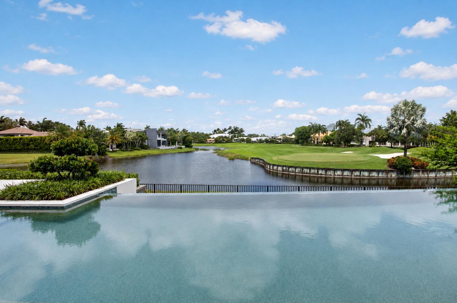 6960 Lake Estates Court Boca Raton, FL 33496 - Photo 42 of 58 a view of a lake with a garden