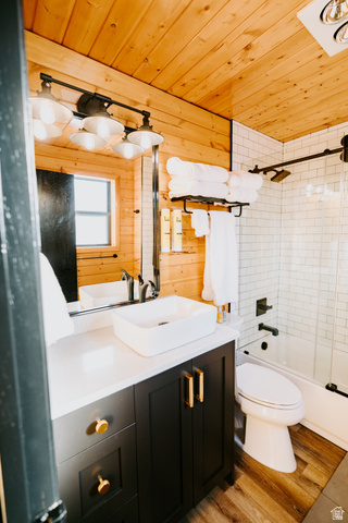 1413 Basel Drive Midway, UT 84049 - Photo 40 of 137 Bathroom with wooden ceiling, vanity, wooden walls, light wood finished floors, and shower / washtub combination