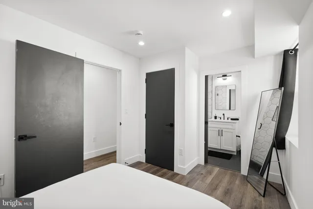 a bedroom with a bed and a dresser