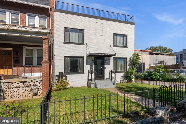 front view of a house with a yard