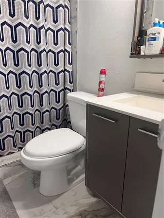 a bathroom with a toilet and a sink