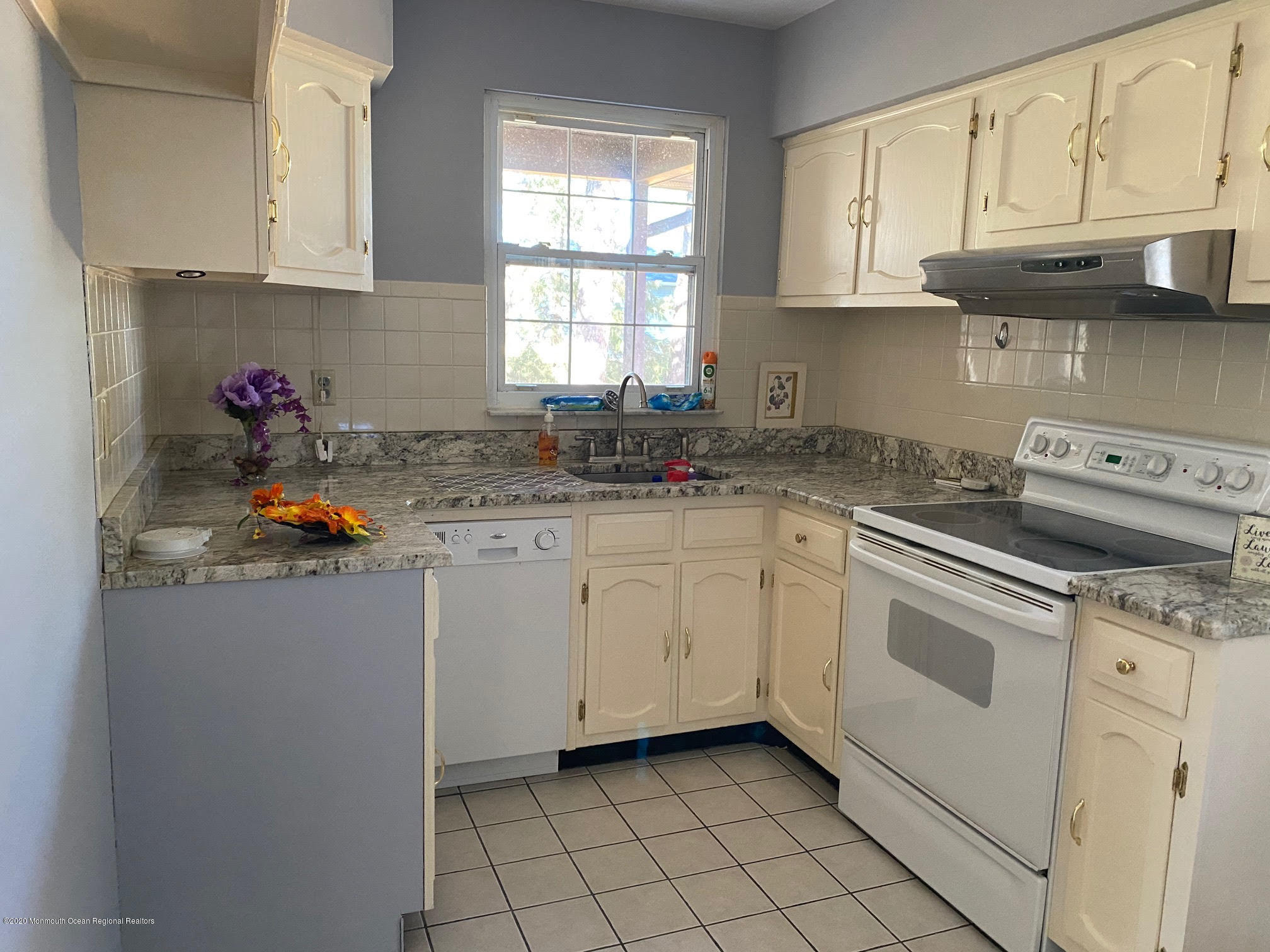 25 A Stonybrook Road Whiting, NJ 08759 - Photo 6 of 13 a kitchen with stainless steel appliances granite countertop a sink stove refrigerator and cabinets
