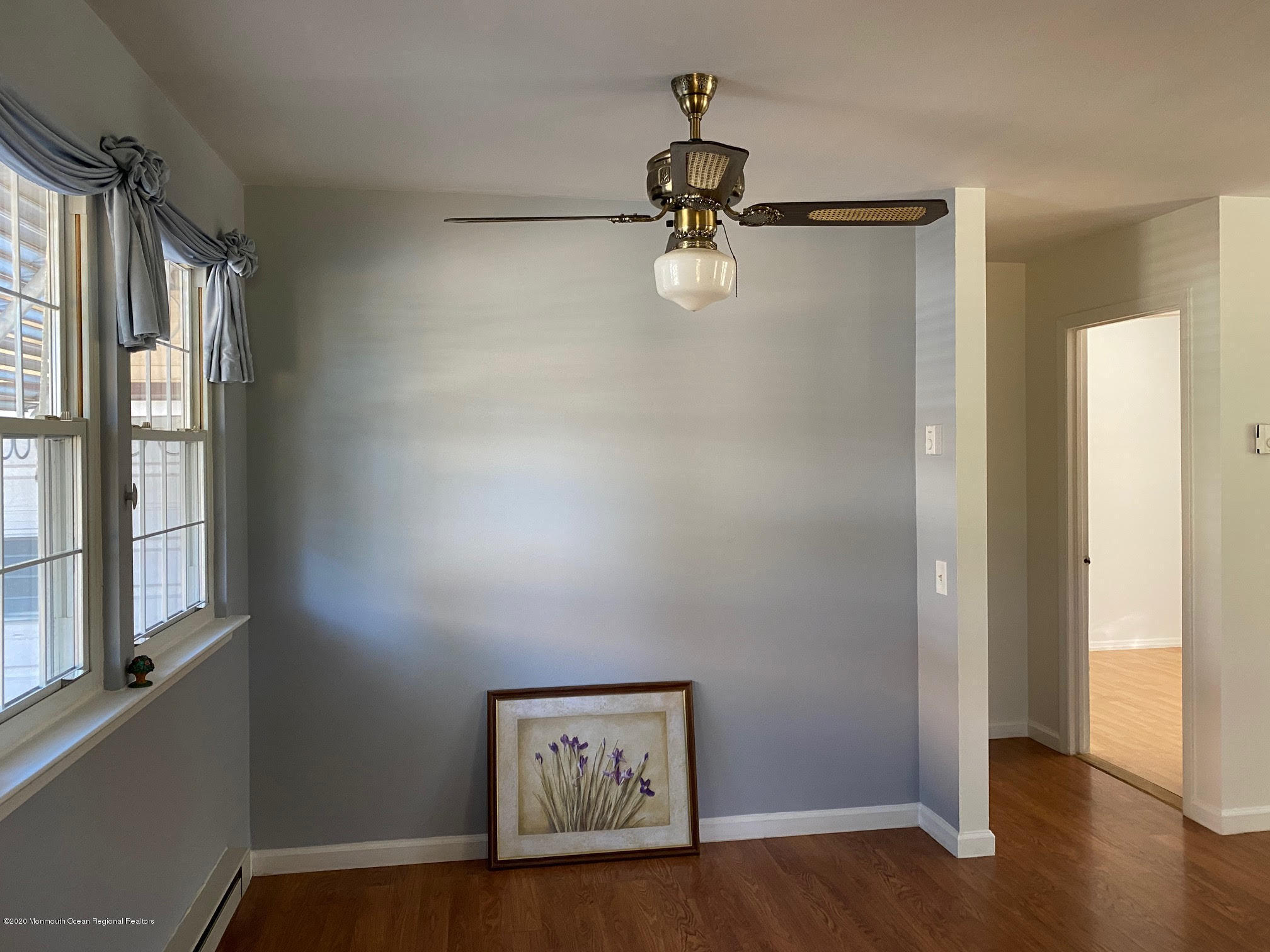 25 A Stonybrook Road Whiting, NJ 08759 - Photo 8 of 13 a view of a hallway with wooden floor and windows