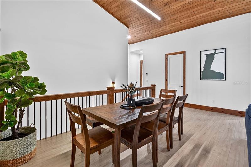351 South Dream Catcher Blue Ridge, GA 30513 - Photo 11 of 52 a view of a dining room with furniture and wooden floor